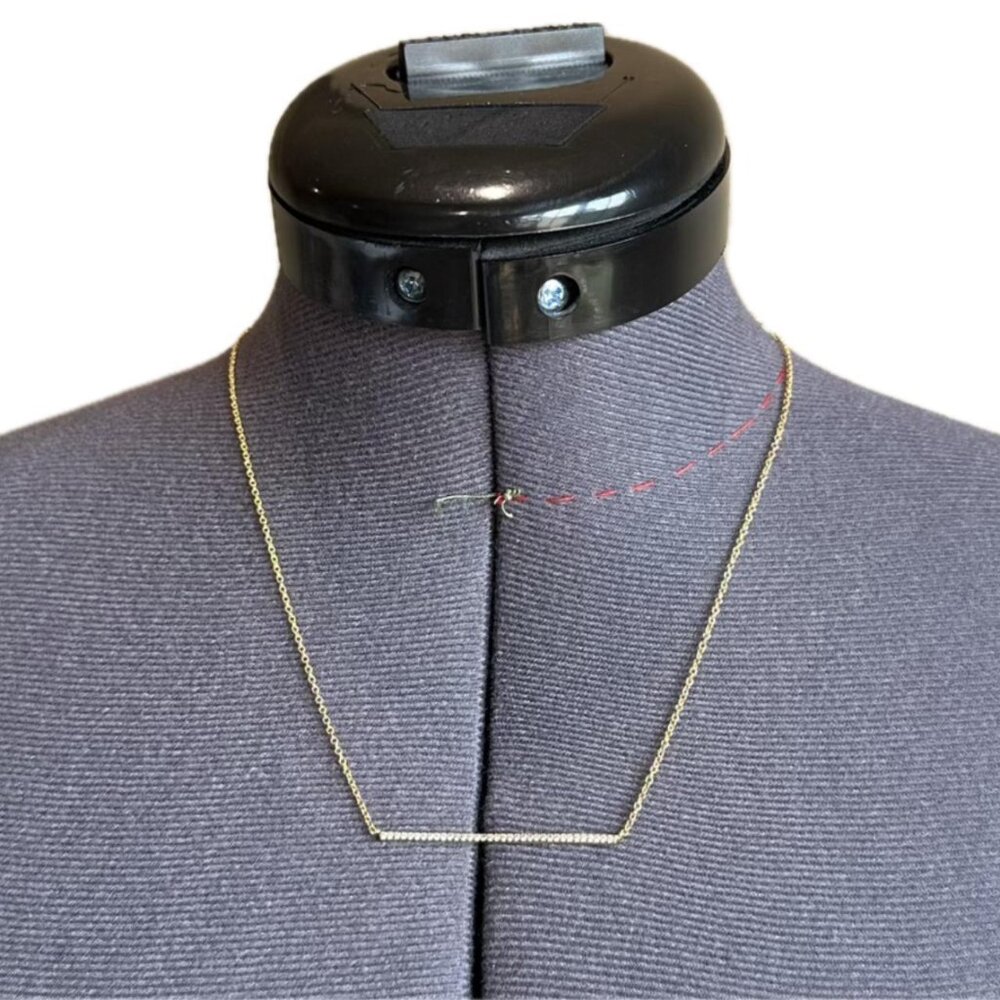Gold necklace with diamond bar